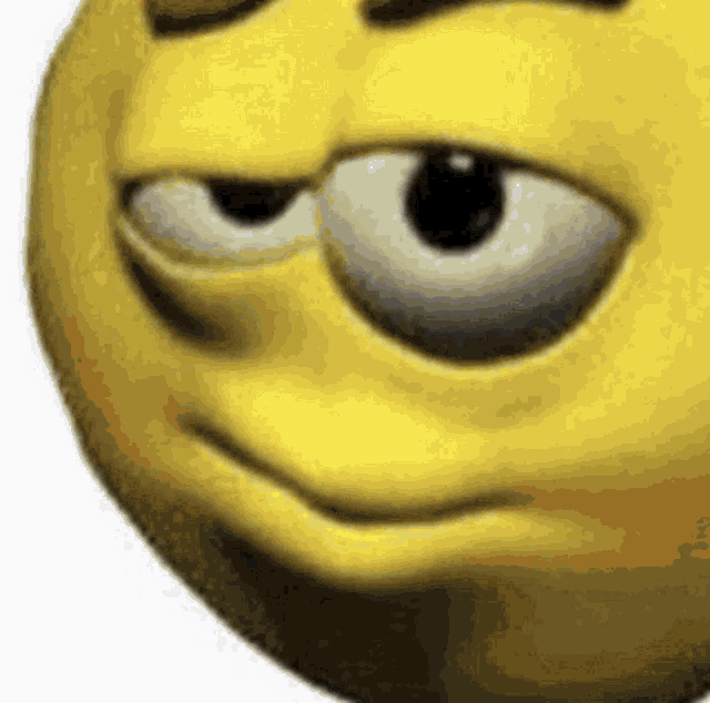 a close up of a cartoon smiley face with a serious look on its face .