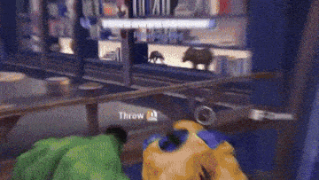 a video game scene with a throw button on the screen