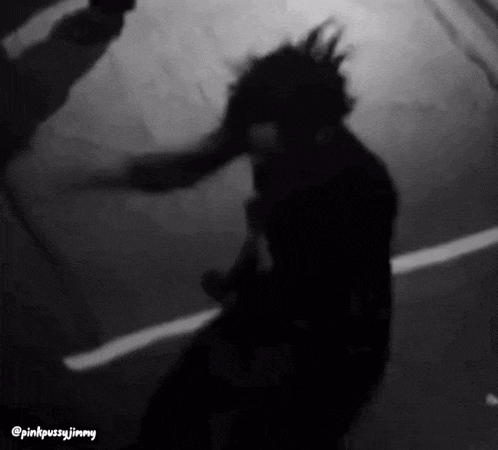 a black and white photo of a person with the words pinkpussyjimmy on the bottom right corner