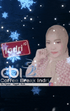 a woman wearing a hijab stands in front of a sign that says ' ndri ' on it