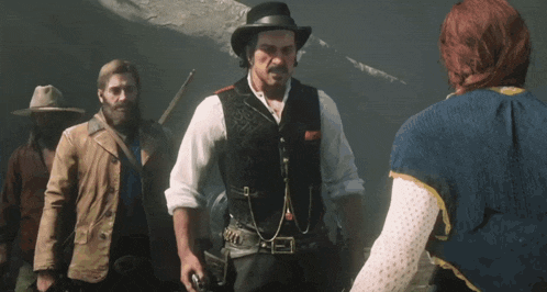 a woman in a red shirt is holding a gun while standing next to a man in a cowboy hat .