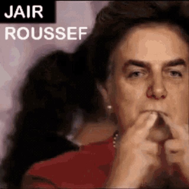 a woman is covering her mouth with her hands and the words jair roussef are above her head .