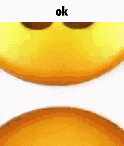 a close up of a yellow smiley face with the word ok on the bottom