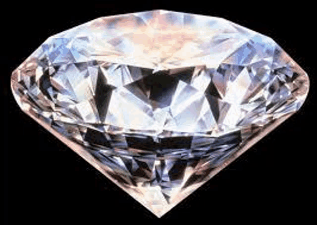 a large diamond is sitting on a black background .