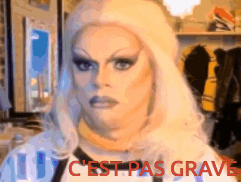 a picture of a drag queen with the words " c'est pas grave " below her