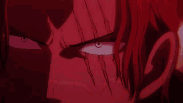 a close up of a red anime character 's eye with a black pupil .