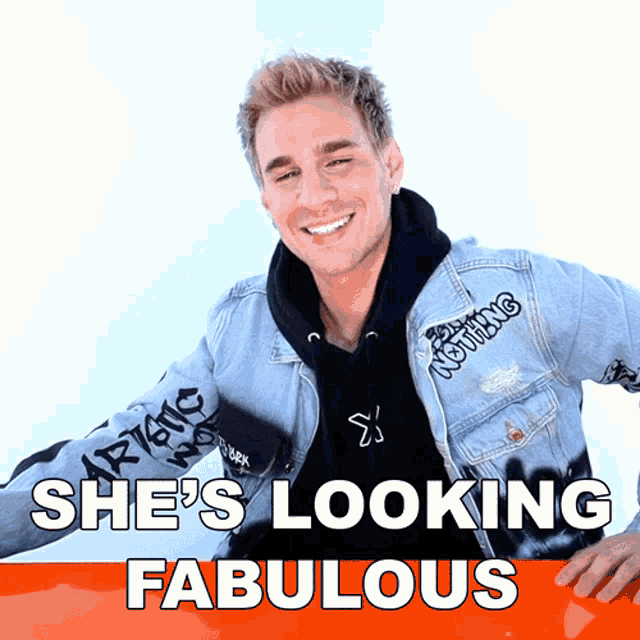 a man wearing a denim jacket that says nothing on it