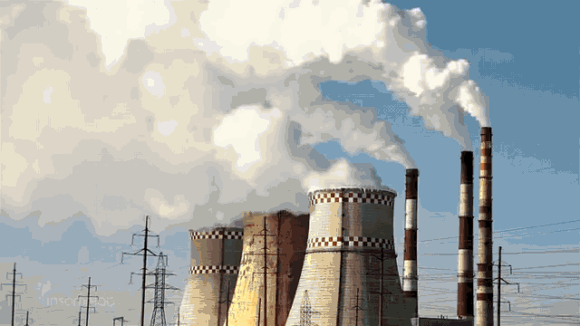 smoke is coming out of the chimneys of a factory with a checkered pattern