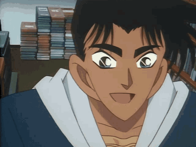 a close up of a man 's face with a bookshelf in the background