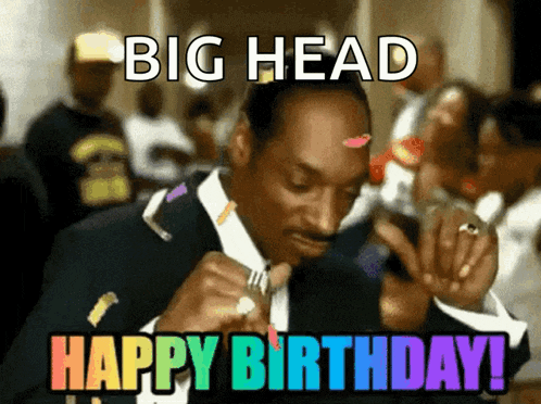 a man in a suit is celebrating his birthday with a big head happy birthday message