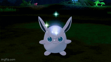 a cartoon turtle is surrounded by a colorful circle of light .