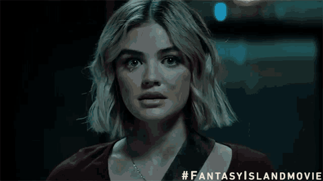 a close up of a woman 's face with the words fantasy island movie below it