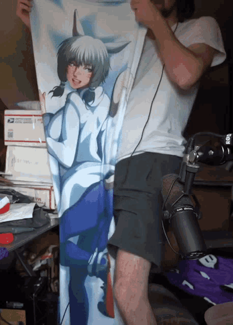 a man holding a pillow with a picture of a woman on it