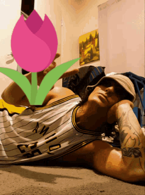 a man laying on the floor wearing a jersey that says ' san diego ' on it