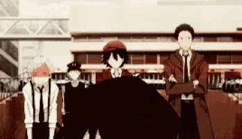 a group of anime characters standing next to each other in front of a building