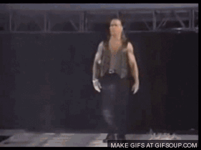 a gif of a wrestler is being made by gifsoup.com