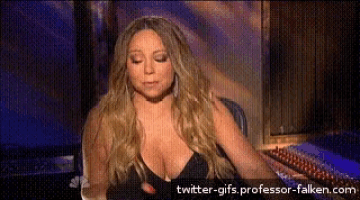 a woman with a very large breast is sitting in front of a twitter-gifs professor-falken.com logo