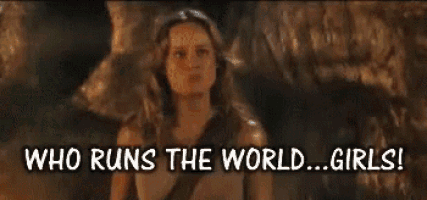 a woman in a cave with the words who runs the world ... girls !