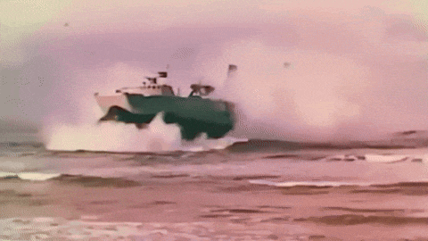 a boat is going through the ocean with a lot of smoke coming out of it