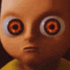 a close up of a cartoon character 's face with big orange eyes