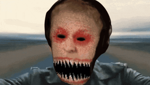 a creepy looking face with a large mouth and teeth