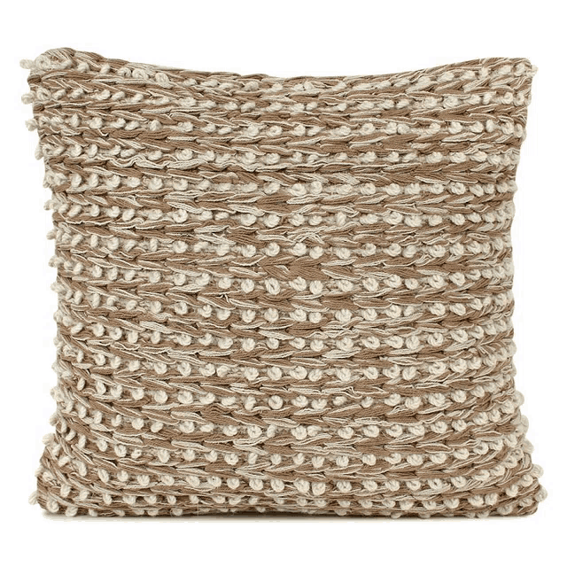 a brown and white pillow with a knitted pattern on it