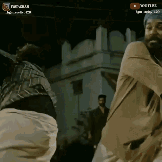 two men are dancing in front of a building with a youtube logo on the bottom right