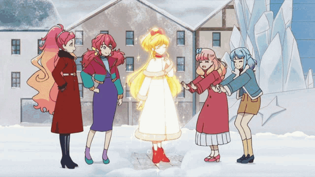 a group of girls are standing in the snow and one of them is wearing a white dress