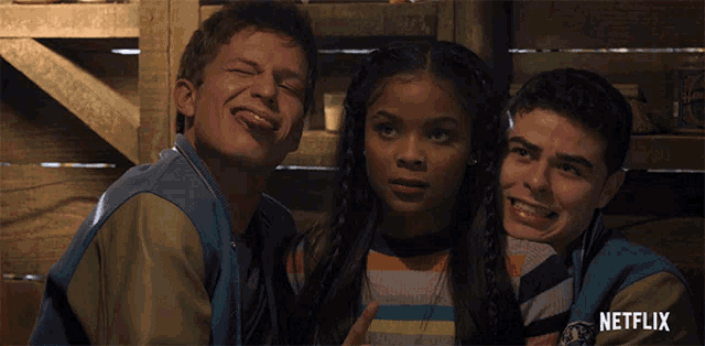 a netflix ad shows a girl sticking her tongue out between two boys