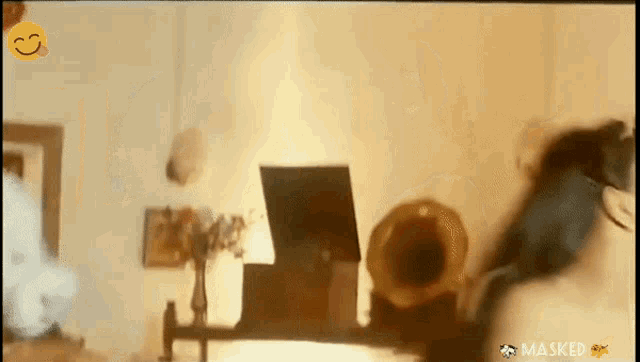 a woman is dancing in a room with masked written on the bottom right