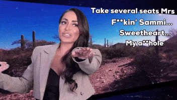 a woman in a suit stands in front of a desert scene with the words take several seats mrs