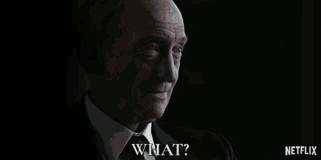 a man in a suit and tie says what in a netflix ad