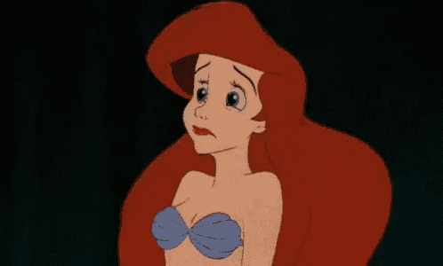 ariel from the little mermaid is crying and looking up at the sky .