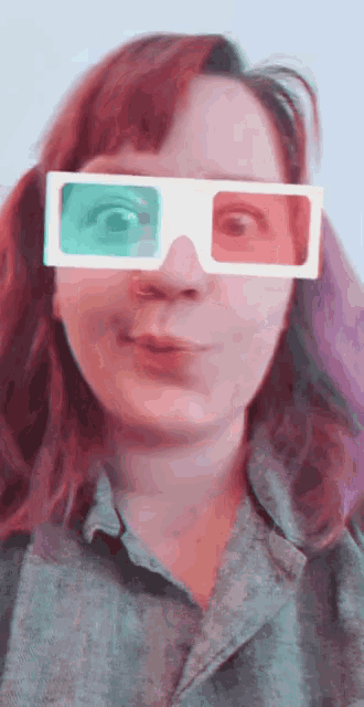 a woman wearing a pair of 3d glasses looks surprised