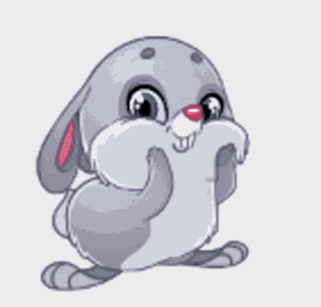 a cartoon rabbit is blowing a red heart in the air .