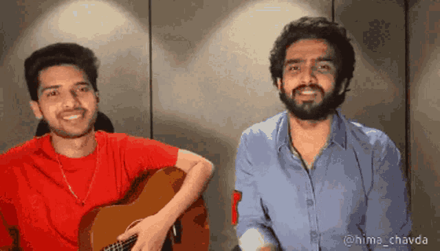 a man playing a guitar next to another man with the name hima_chavda on the bottom