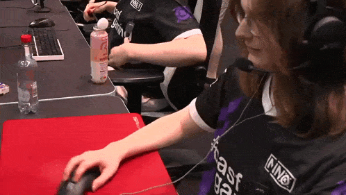 a woman wearing headphones and a shirt that says ning on it