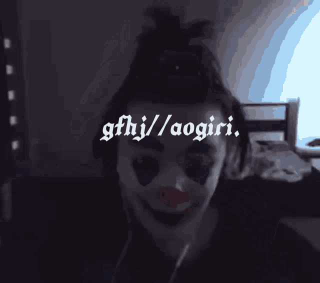 a woman in a clown costume has the url ggfhj / aogiri on the bottom right