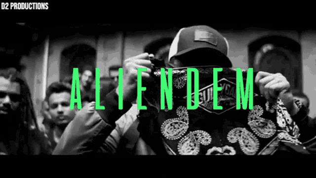 a black and white photo of a man holding a bandana with the words aliendem on it