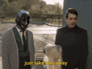 two men standing next to a dog and the words just take him away