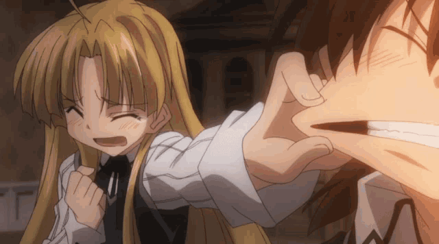 a girl with blonde hair is being held by a boy