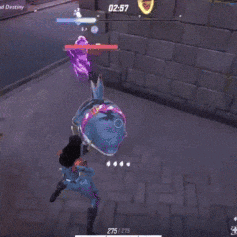 a person is playing a video game with a frog in the middle of the game .