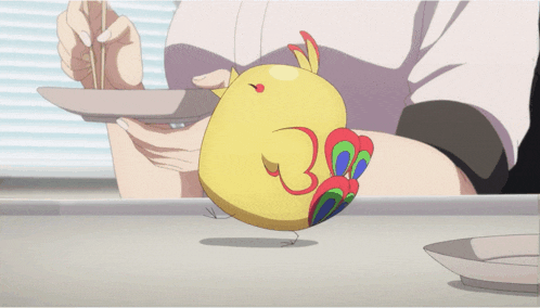 a person is holding a plate with a yellow bird on top of it