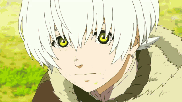 a young boy with white hair and green eyes is looking at the camera