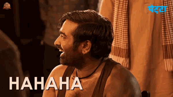 a man with a beard is laughing in front of a sign that says " hahaha "