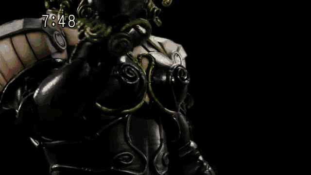 a close up of a person holding a sword in a dark room with the time 7:48