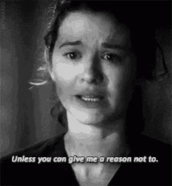 a black and white photo of a woman crying with the words `` unless you can give me a reason not to . ''