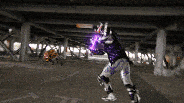 a person in a purple and silver costume stands in a parking garage