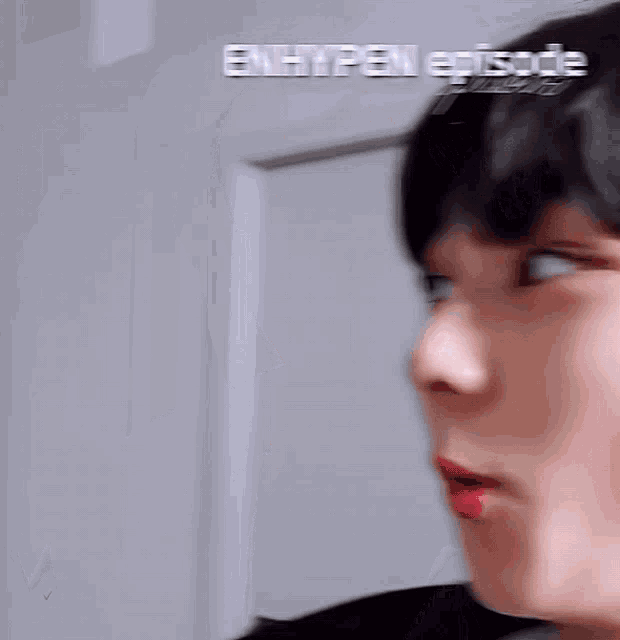 a blurry picture of a person 's face with the words enhypen episode written above it