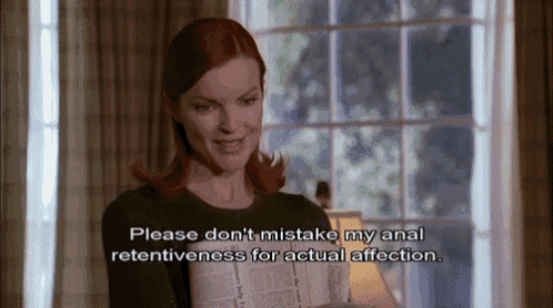 a woman is holding a newspaper and saying please don t mistake my anal retentiveness for actual affection
